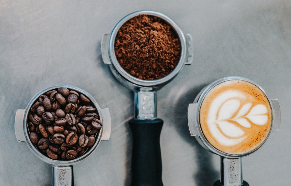 coffee beans, ground coffee and a latte